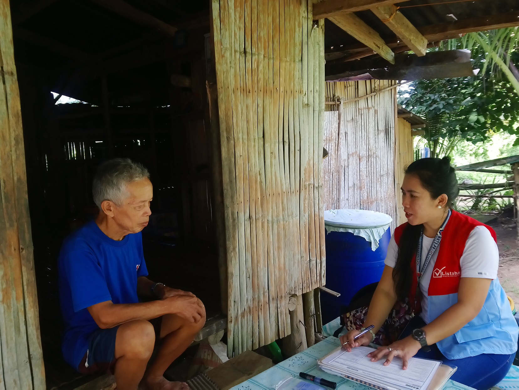 A field enumerator in Torrijos, Marinduque administers house-to-house interviews to collect accurate data for the Listahanan 3rd round household assessment.