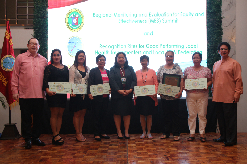 MIMAROPA Regional BHW Federation Awardees with their Performance-Based Cash Incentives poses with Asec Eric A. Tayag (left), Ms Anna Birtha Datinguinoo (center) and Regional Director Eduardo C. Janairo (right) the during the ME3 Summit and Recognition Ceremonies held at the Century Park Hotel, Manila on May 3, 2017.