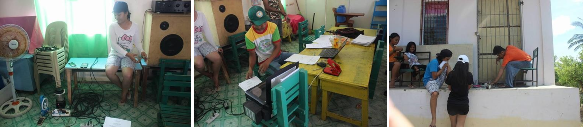 A solar-powered building in Binunga Elementary School in Brgy. Yook, Buenavista, Marinduque provides a source of power to one of its school teachers (center) and the evacuees of Typhoon Nina ( left and right photo) for the printing of school reports and charging of their mobile phones, respectively, during a wide power outage in Marinduque after Typhoon Nina lashed the province.