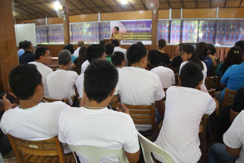 DOH-MIMAROPA Regional Director Eduardo C. Janairo emphasized the importance of the drug rehabilitation program to the 39 drug surrenderees (in white shirts) in Calapan City during a visit at the Bishop's Palace which acted as rehabilitation center in Oriental Mindoro.